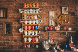 ceramic mugs, brick wall. shelf